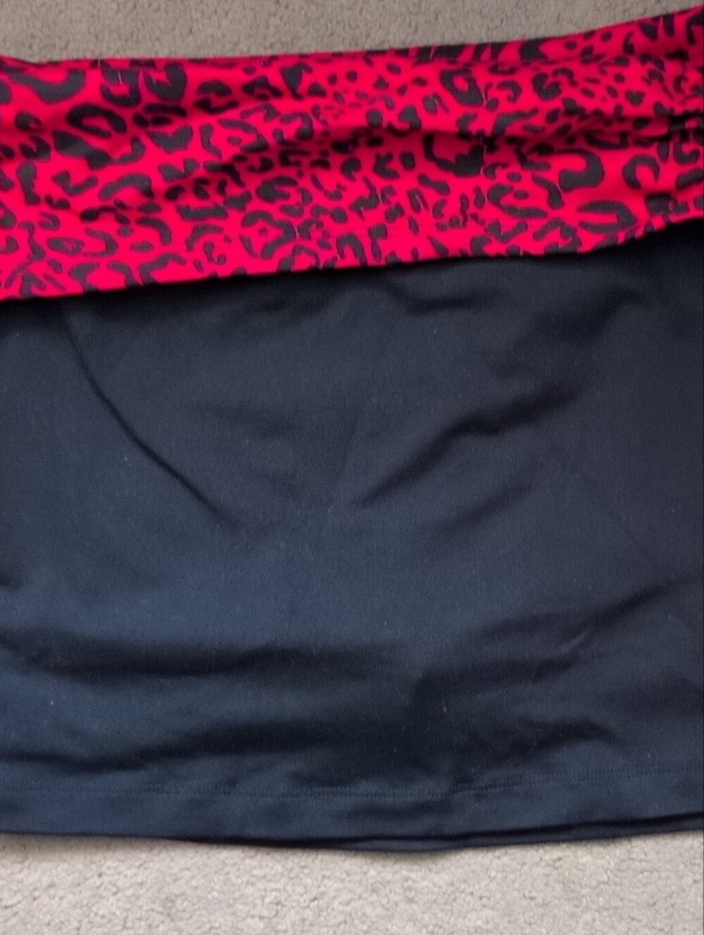 bebe Black Tennis Mini Skirt with Red Leopard Waistband and built-in shorts.
